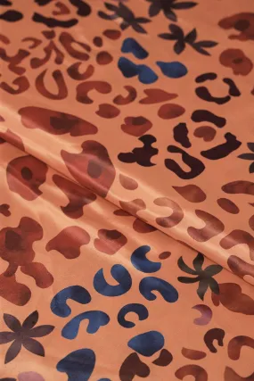 Brown And Blue Abstract Print On Pastel Orange Crepe Fabric